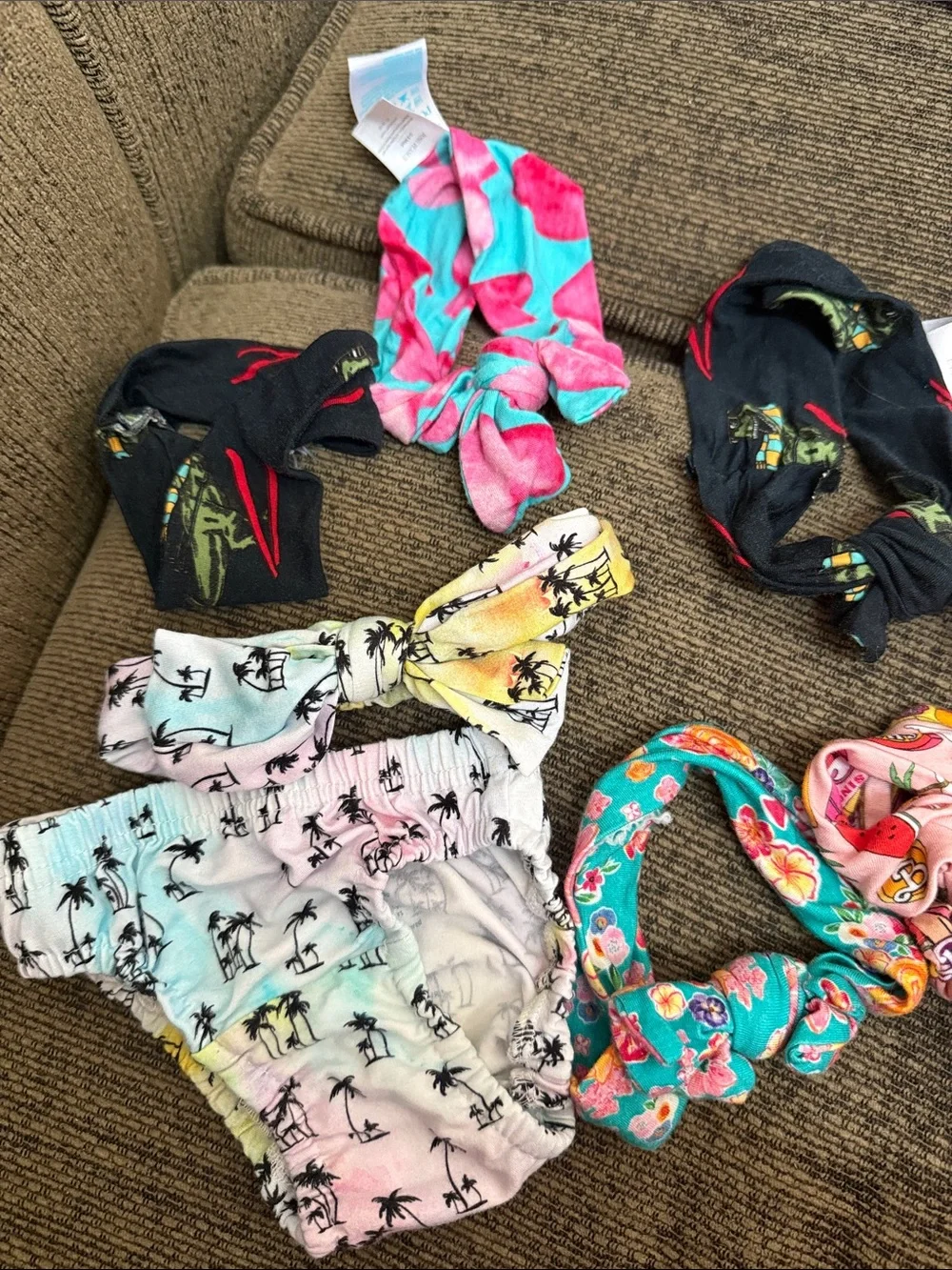 Baby headbands, hat, and bloomers from Posh Peanut and CocoMoon Hawaii